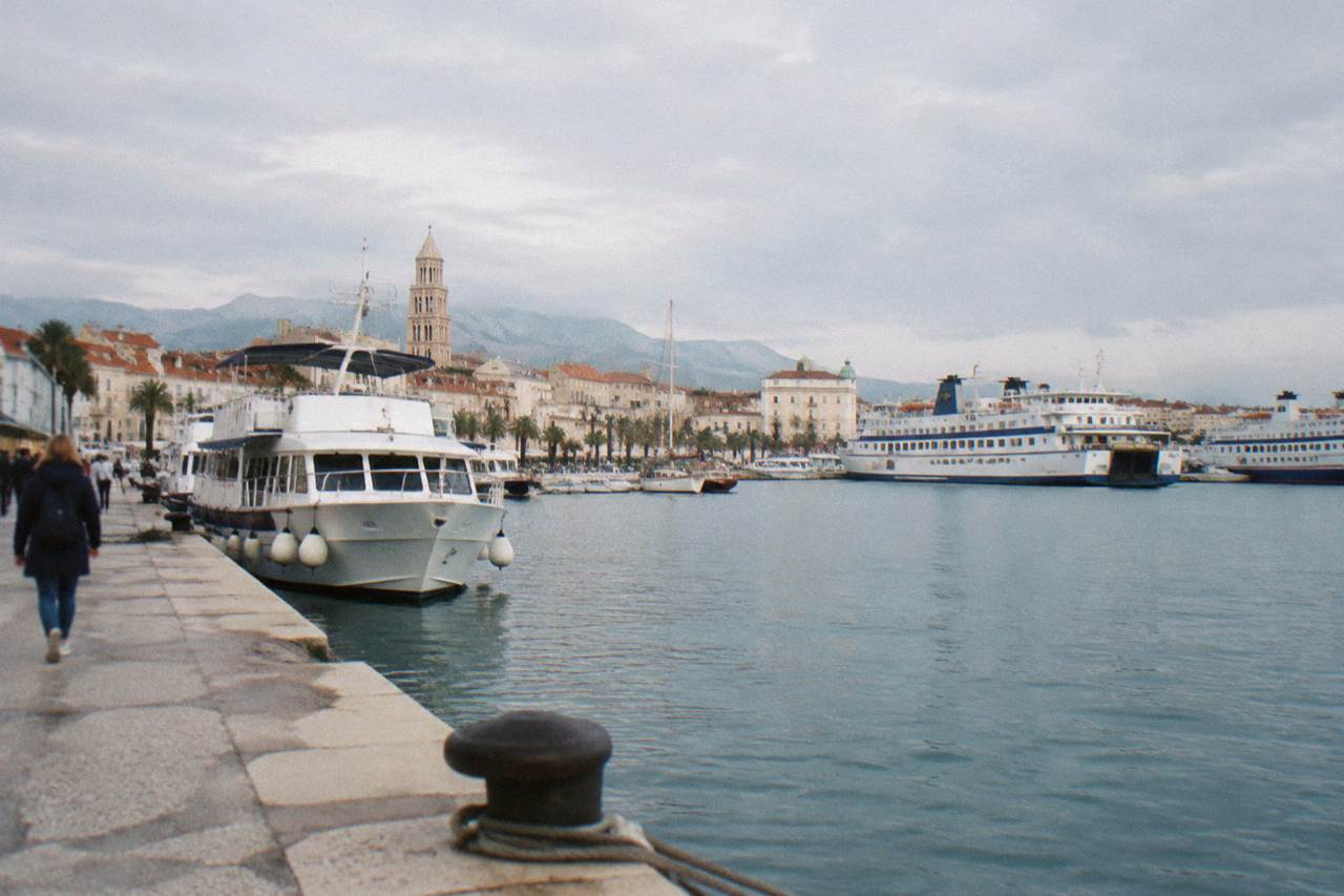 Passenger ferries and boats moored along the waterfront in Split harbour