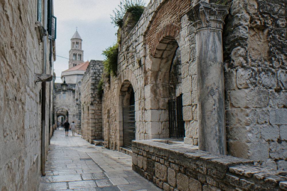 Stone alleys and ancient walls inside Diocletian's Palace in Split on a sunny afternoon