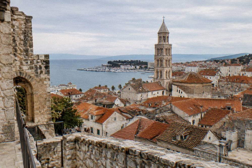 Split Old Town rooftops and the cathedral bell tower seen from above in warm afternoon light