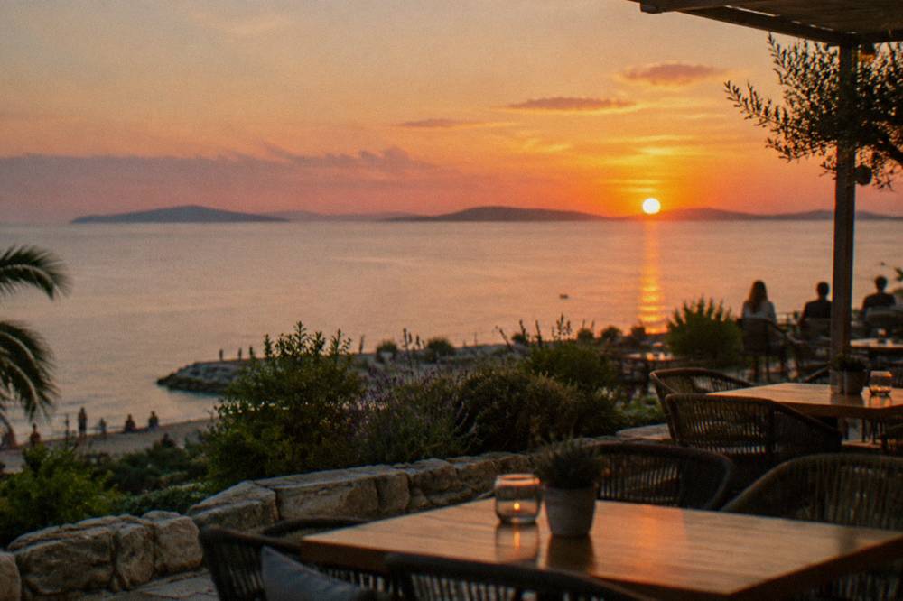 Evening café terrace along the top of the Žnjan plateau with the Adriatic fading to the horizon