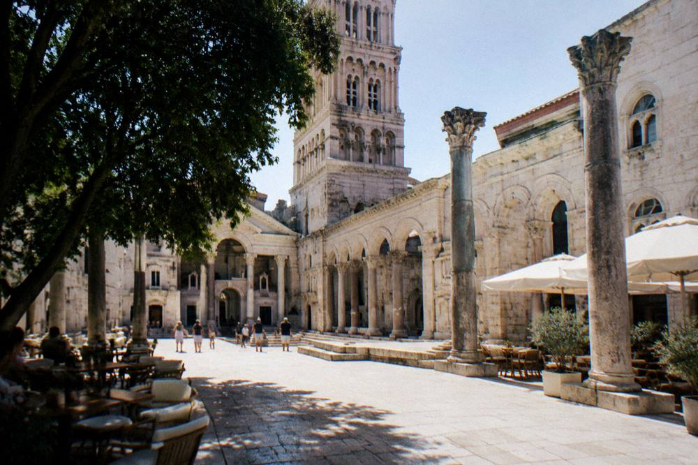 The Peristyle square beside the cathedral with its Roman columns and cafe tables