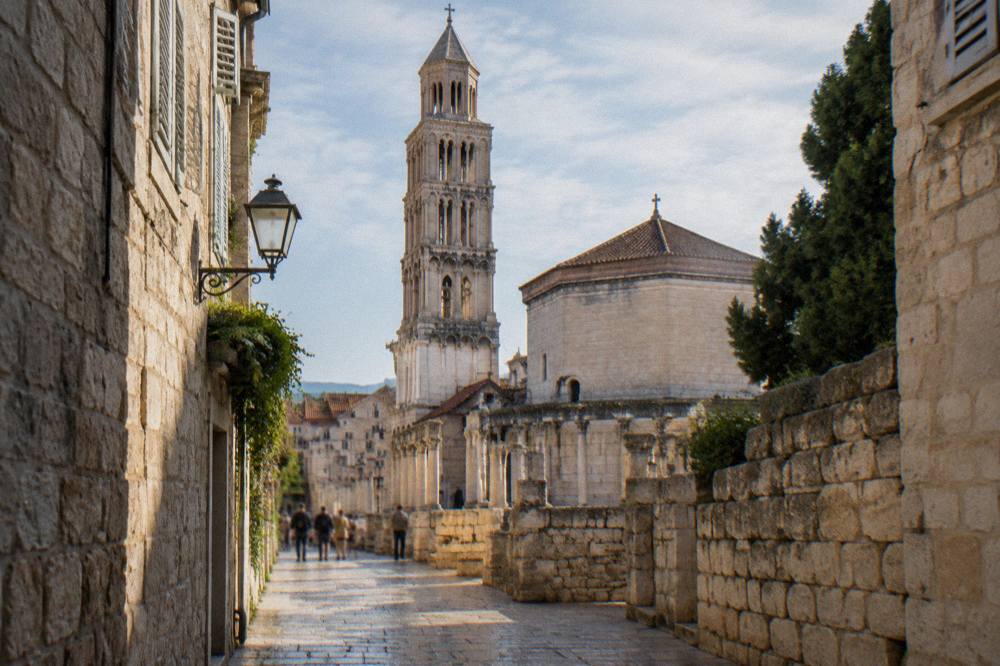 Sunlight on the ancient stone walls and narrow lanes of the Old Town of Split near the cathedral