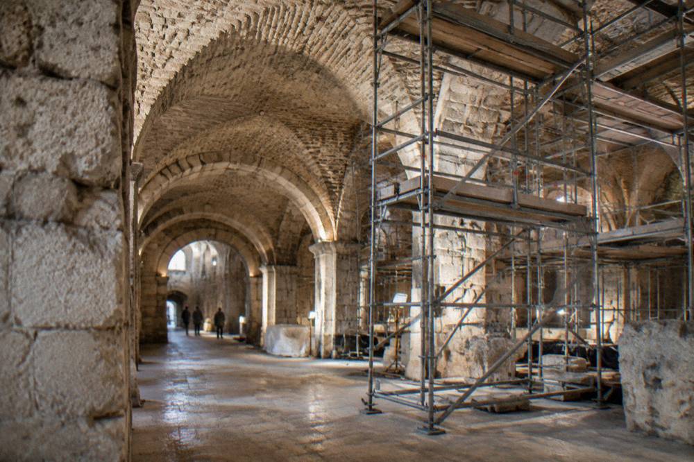 Conservation scaffolding set up inside a vaulted Roman cellar hall