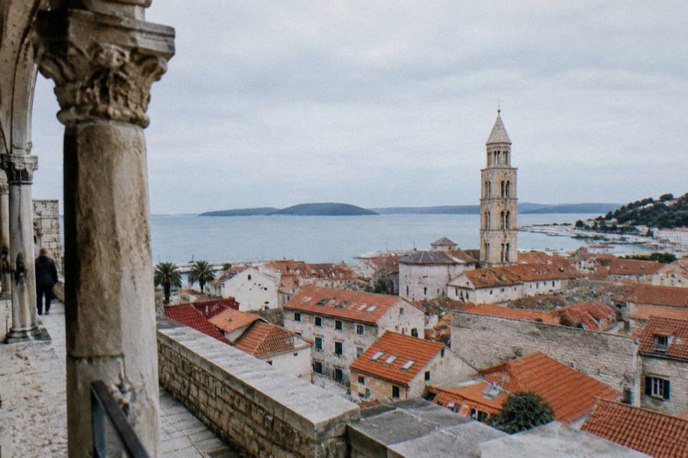 View over the red roofs of Split old town toward the sea and offshore islands