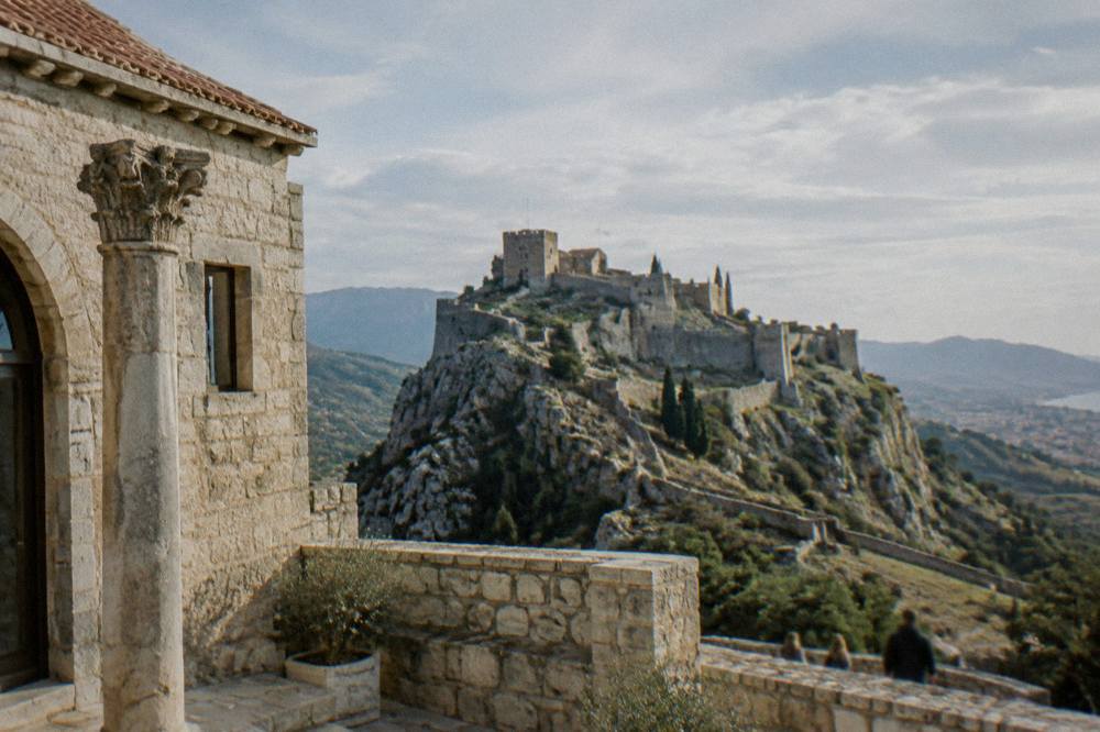 Klis Fortress on a rocky ridge above the countryside near Split