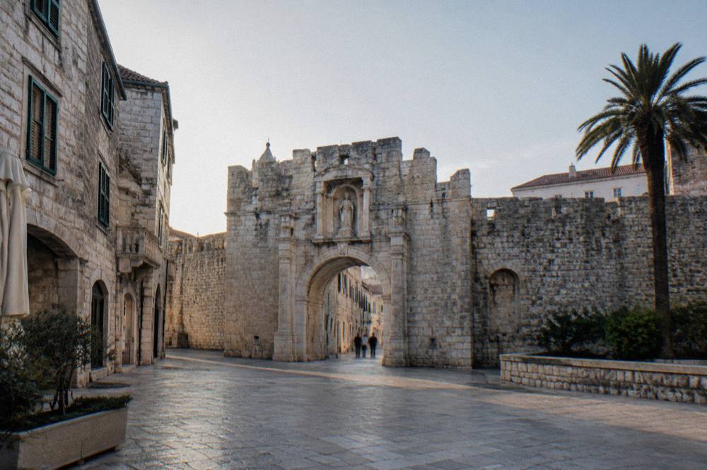 A wide view of the Golden Gate facade seen from the square outside the palace walls in Split
