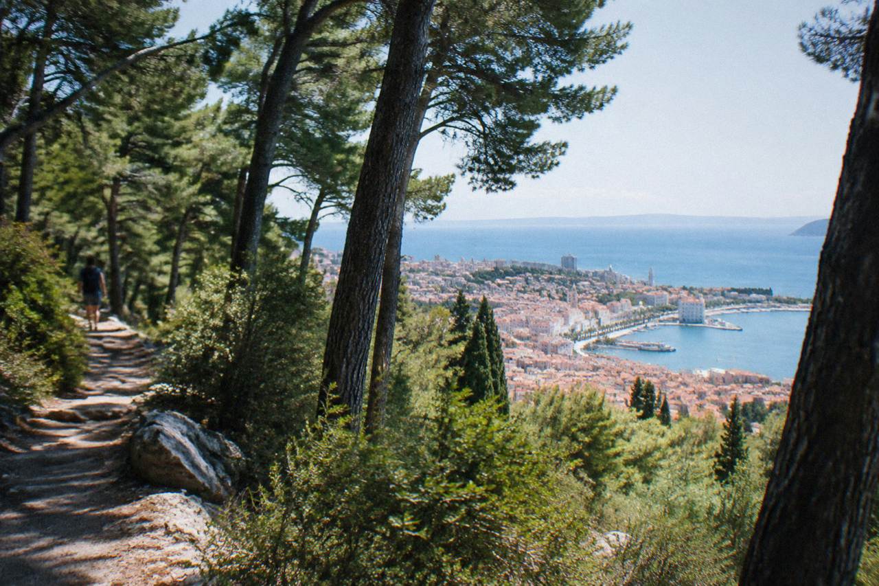 The Marjan hill forest park rising above the red roofs of Split and the blue Adriatic sea