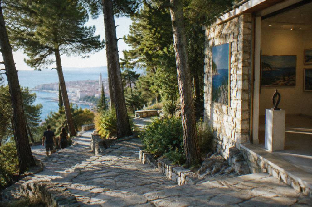 A stone staircase climbing through pine woods on the Marjan peninsula in Split