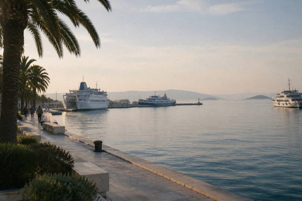 Harbour view from the promenade with ferries moored at the Split piers and islands on the horizon