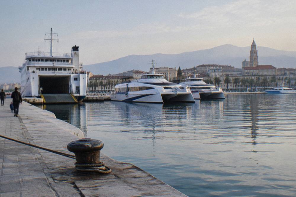 A car ferry and catamarans moored at the Split waterfront passenger port