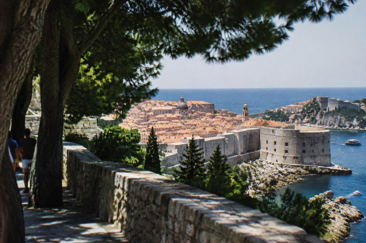 Stone walls and terracotta rooftops of Dubrovnik old town above the Adriatic Sea