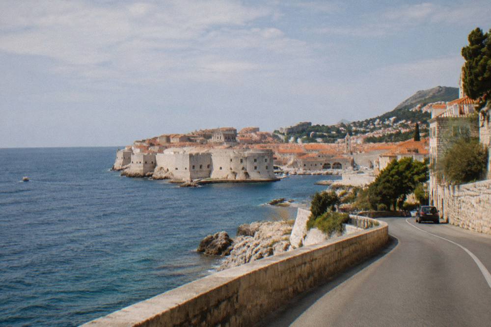 Coastal road winding along the Adriatic south of Split toward Dubrovnik