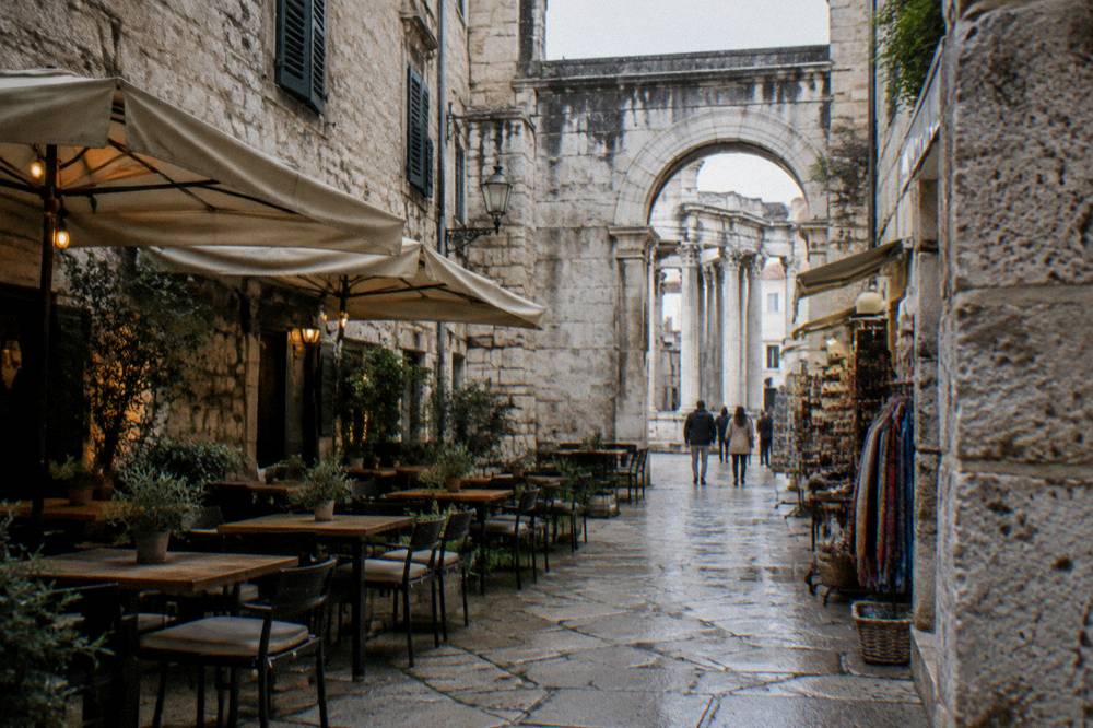 A stone alley inside Diocletian's Palace with cafes and small shops