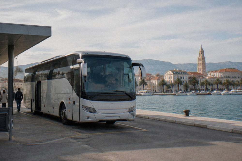 Intercity coach parked at Split main bus station beside the harbour