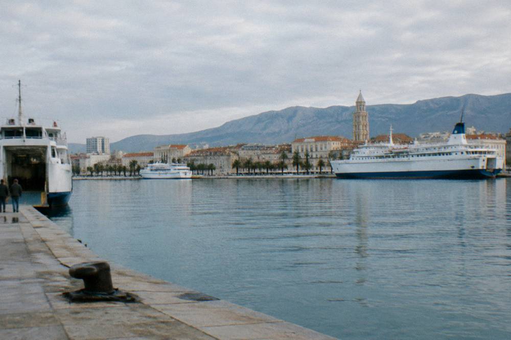 A harbour view over Split with ferries moored along the waterfront in morning light