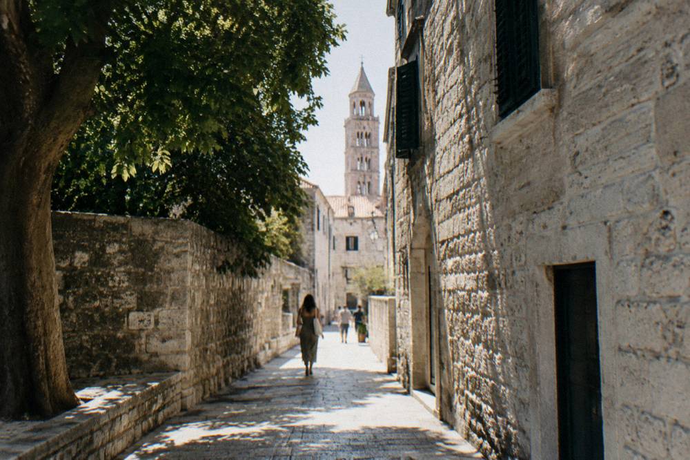Narrow stone lanes in an old town with no cars and people walking