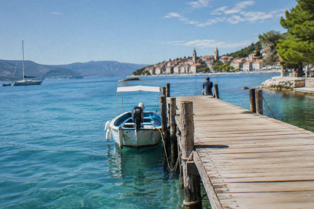 Wooden jetty on a Dalmatian island with calm turquoise water