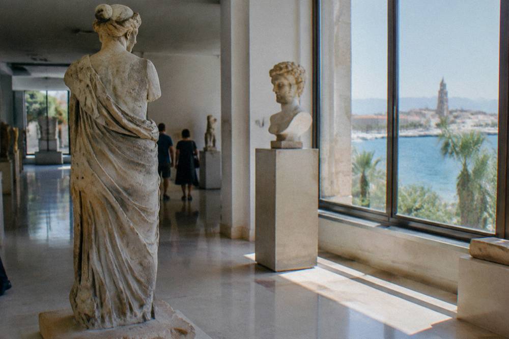 Classical sculpture displays inside a bright museum gallery in Split