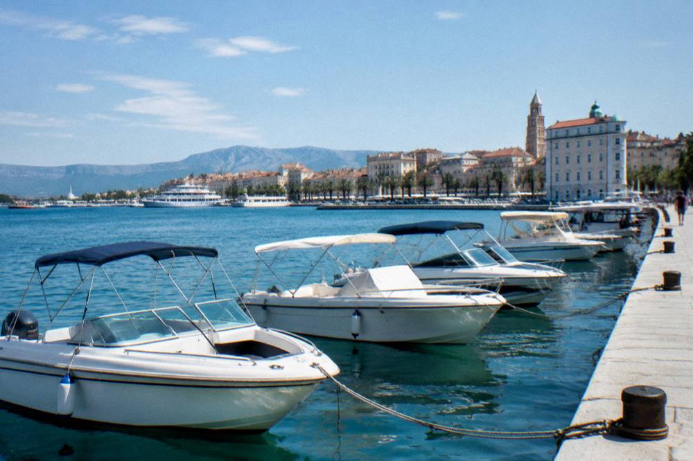 Speedboats moored in a line at the Split waterfront in the morning