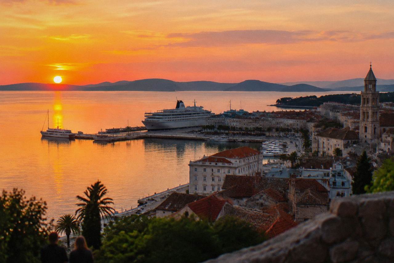 Evening view over Split harbour with the ferry port and palace rooftops in warm light