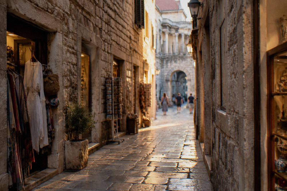 Narrow stone lane inside Diocletian's Palace in Split lined with small shopfronts