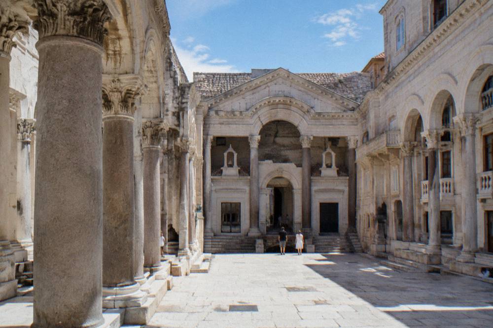 Stone arcades and columns of an ancient Roman palace courtyard in Split