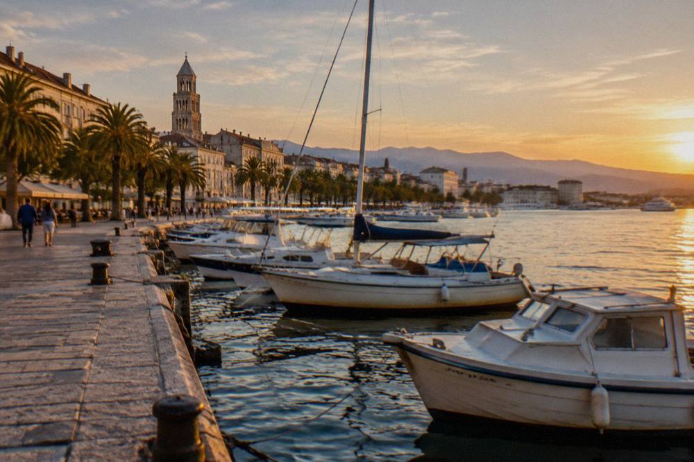 Boats moored along the Riva promenade in Split with the sea front on the right