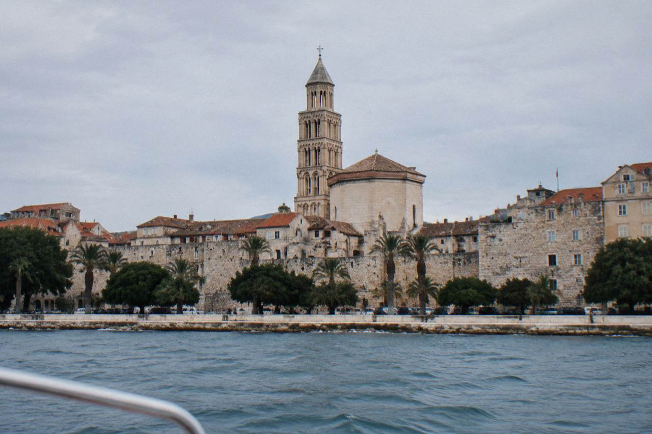The stone walls and bell tower of Diocletian's Palace seen from a boat on the Adriatic near Split