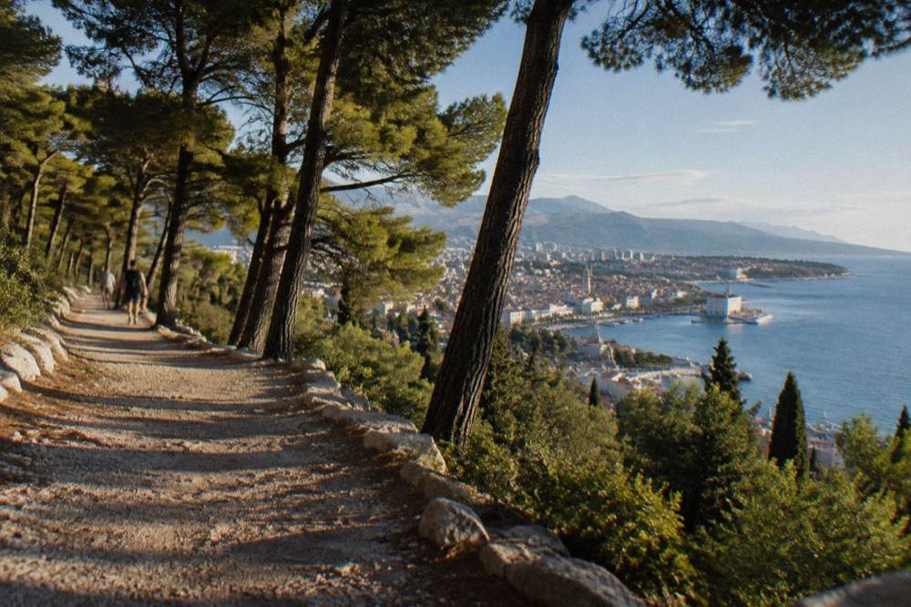 Pine shaded path along the Marjan peninsula above the Adriatic with Split below
