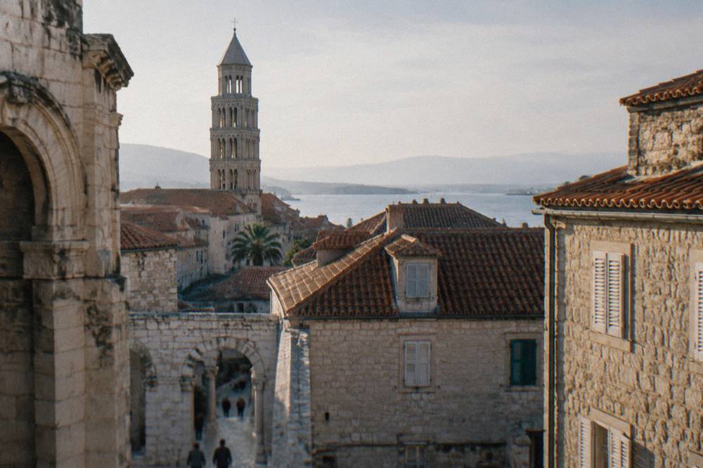 Stone apartment buildings and terracotta roofs in central Split in morning light