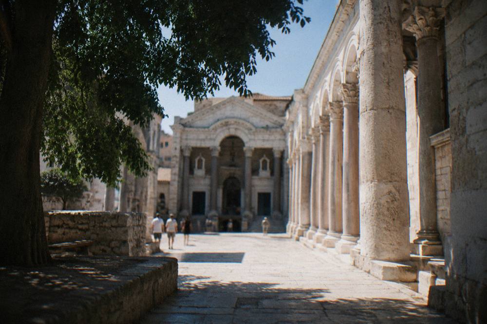 Sunlight falling on the stone columns of the Peristyle square inside Diocletian's Palace