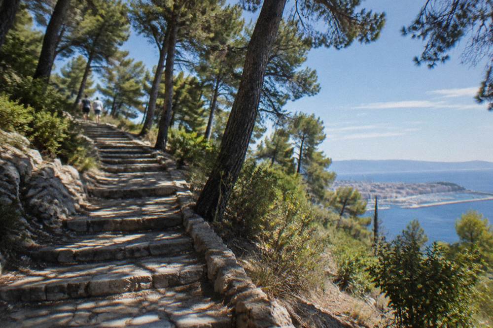 Stone steps winding up through pine forest on Marjan hill above the sea