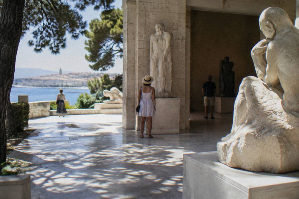 Visitors looking at sculpture in the stone galleries of the Mestrovic Gallery in Split