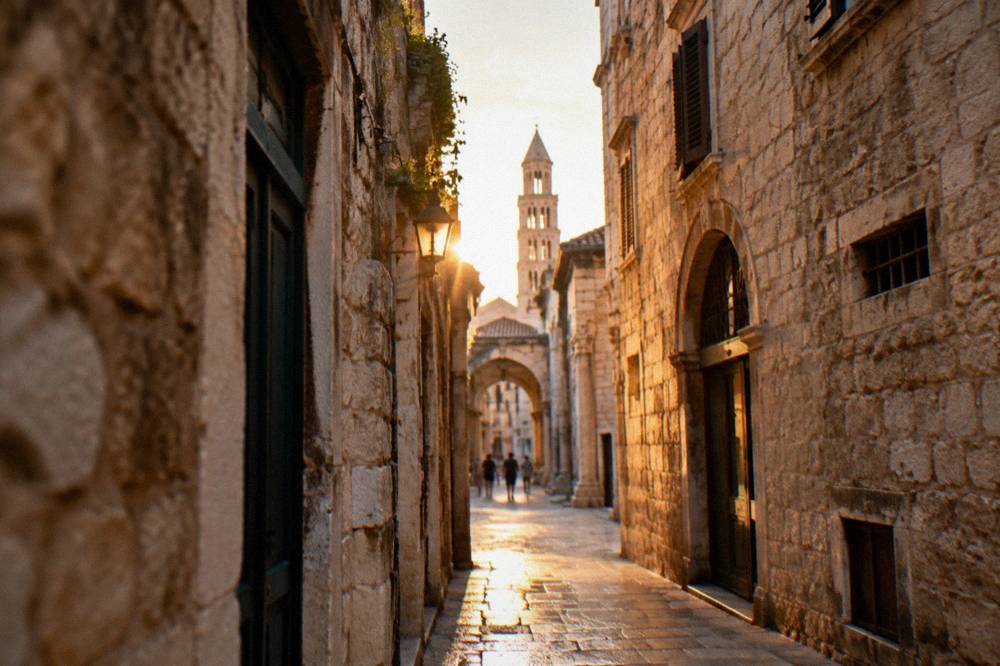 Narrow stone lane inside Diocletian's Palace in Split lined with old buildings