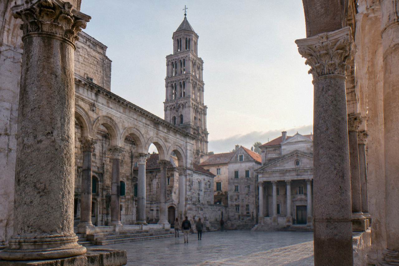 The Peristyle square inside Diocletian's Palace in Split with its Roman columns and cathedral bell tower above the rooftops