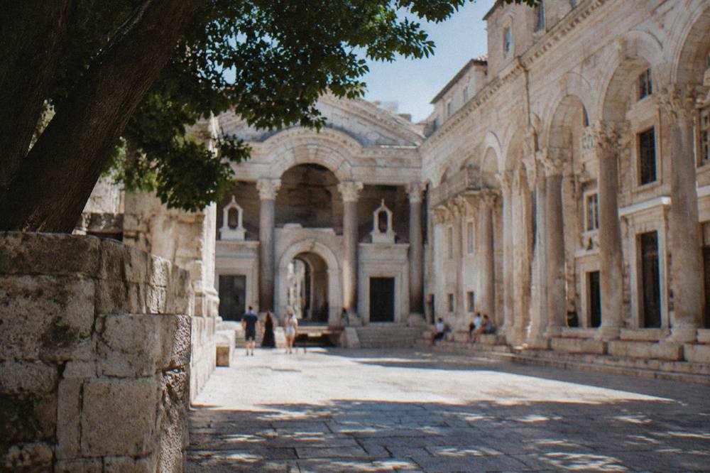 Stone arches and columns of the Peristyle courtyard in Diocletian's Palace in morning light